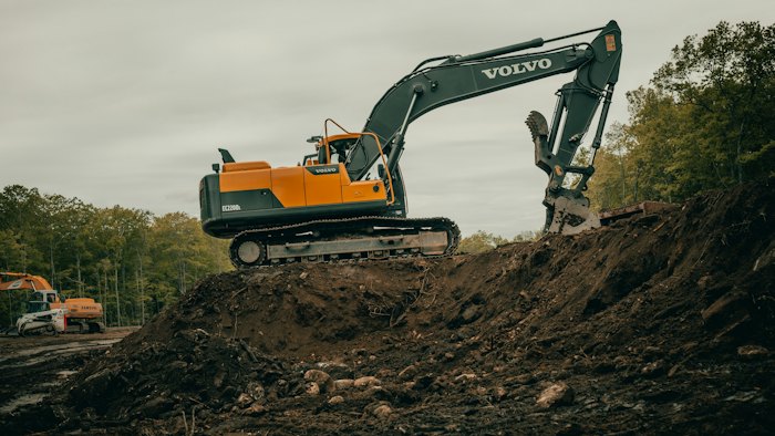 Excavator working on graded ground