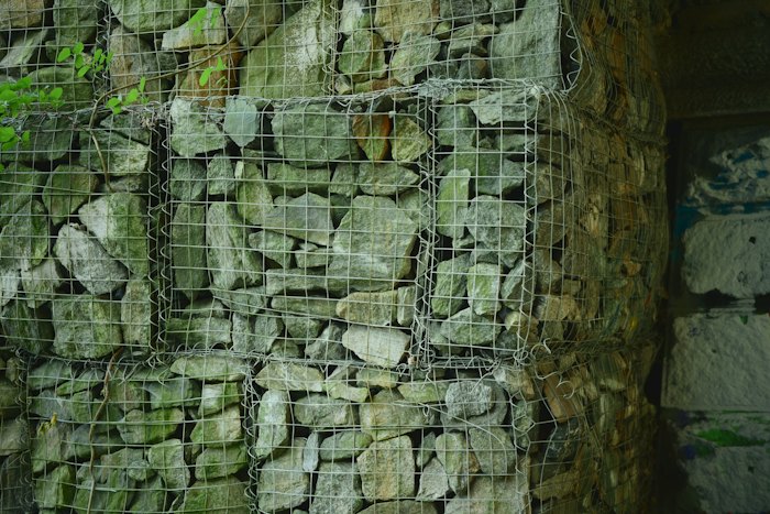 Gabion rock and wire retaining wall