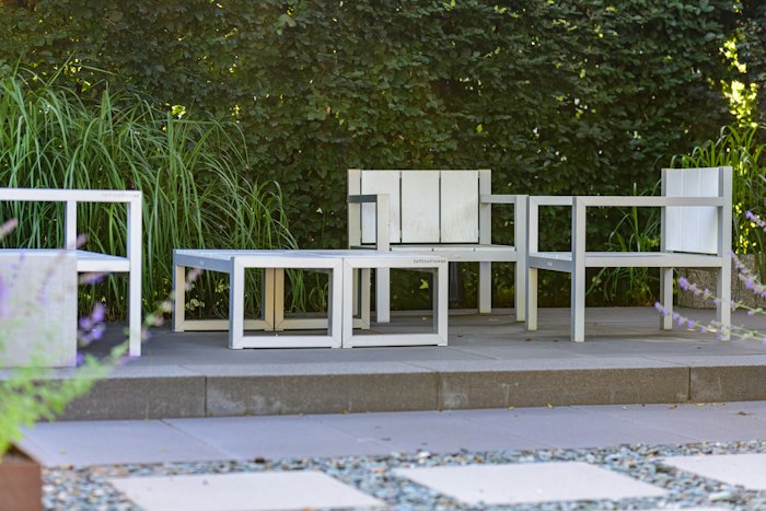 Landscaped patio with outdoor seating and plants