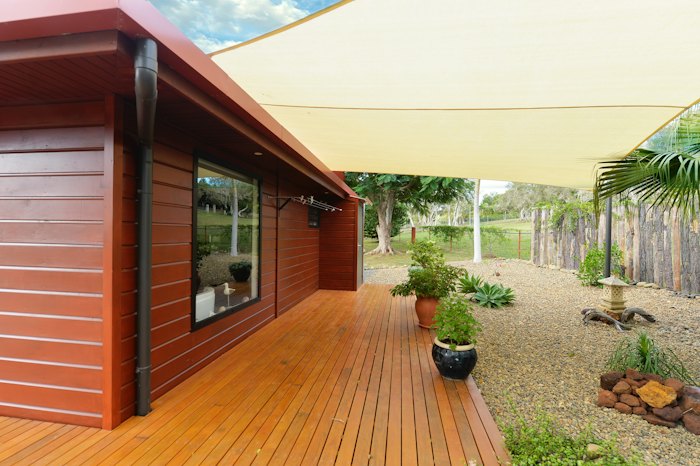 Gravel garden beside a wooden deck